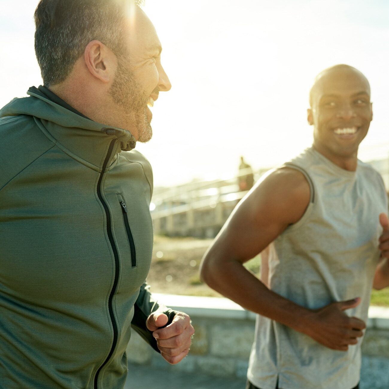 two sporty men exercising together outdoors